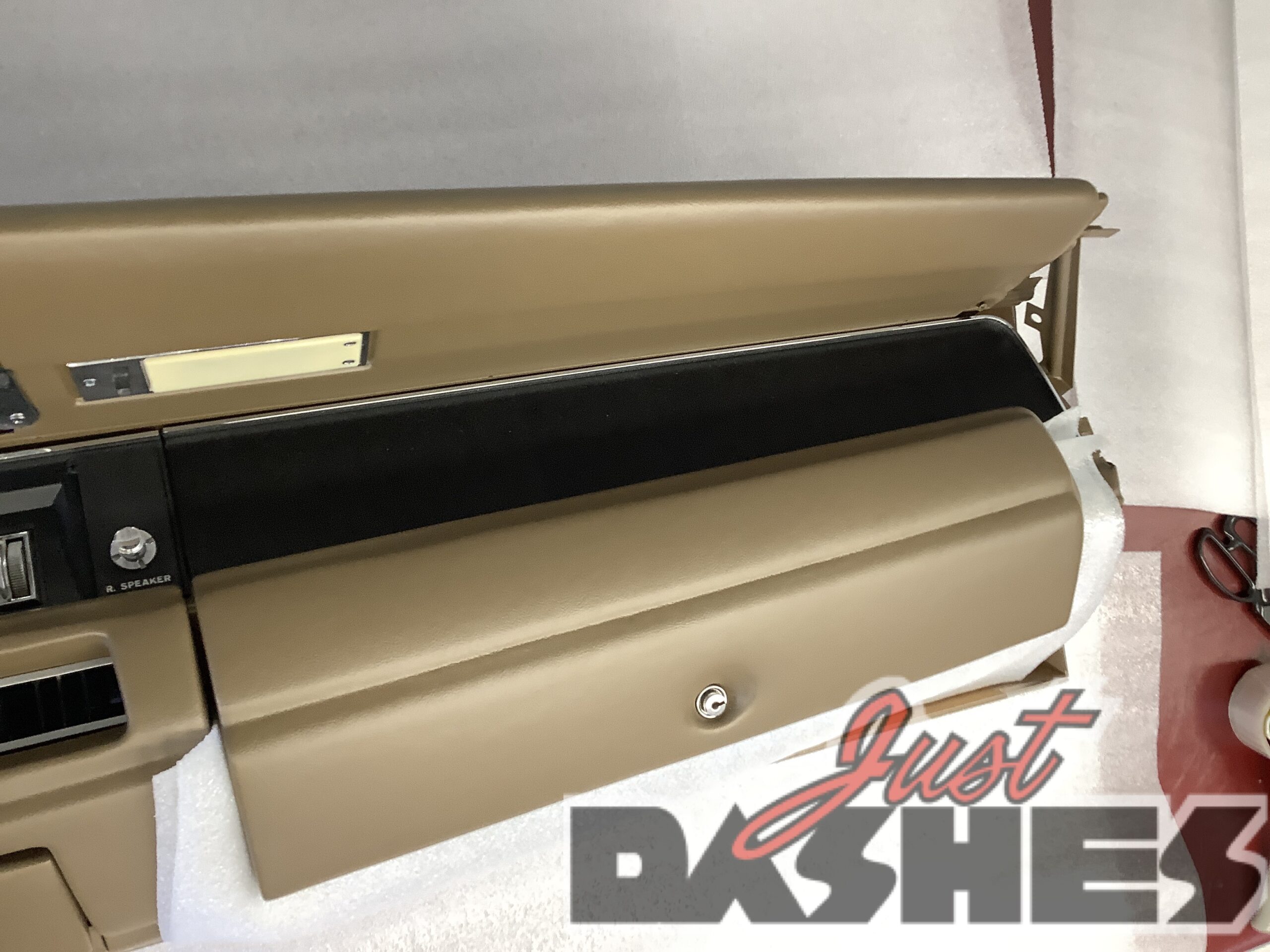 A classic Dodge Charger dashboard with the door open, showcasing its iconic design and timeless appeal.