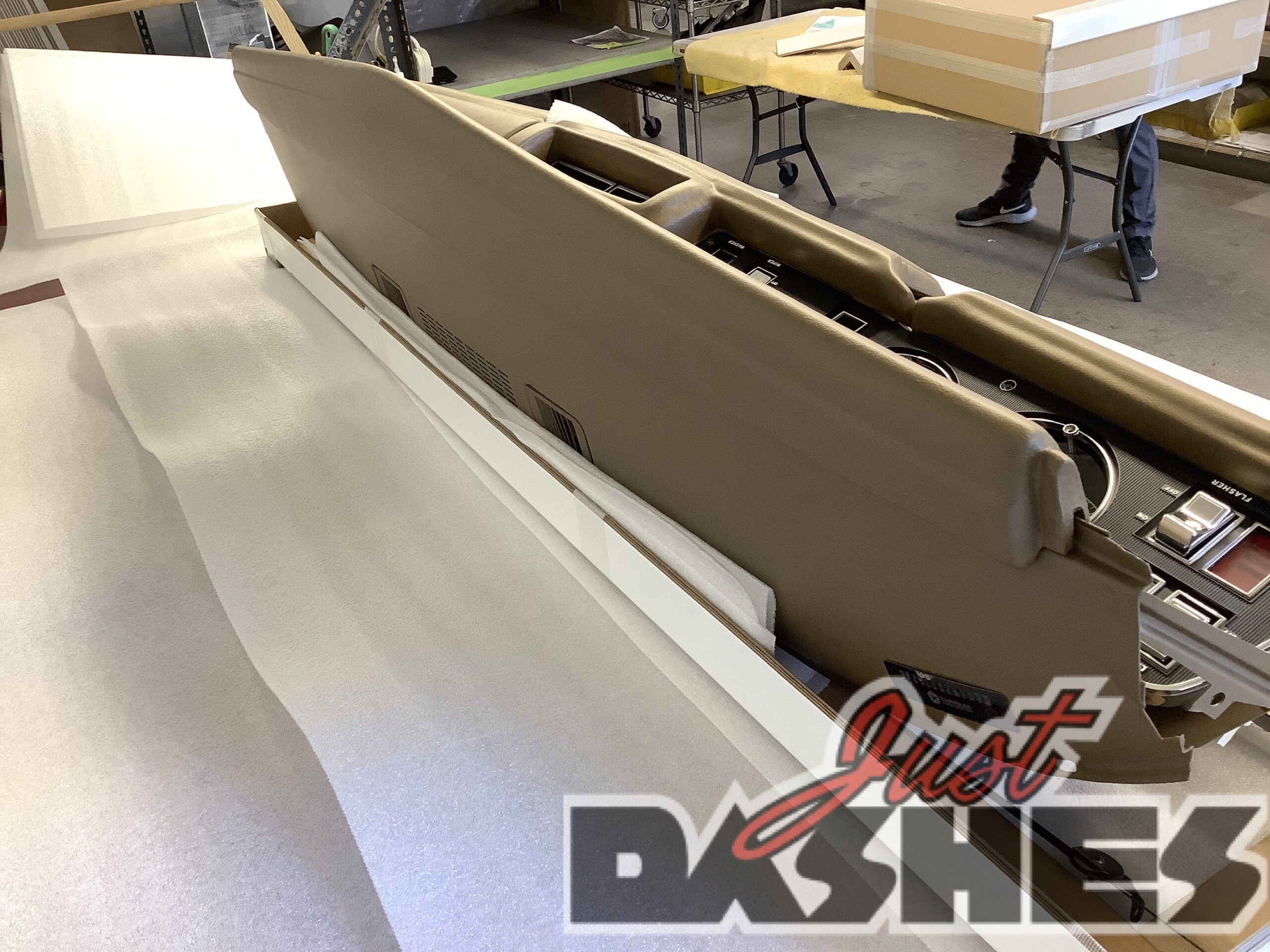 Restored vintage car dashboard, beige finish.