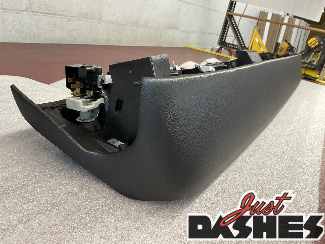 Refurbished car dashboard with smooth finish.