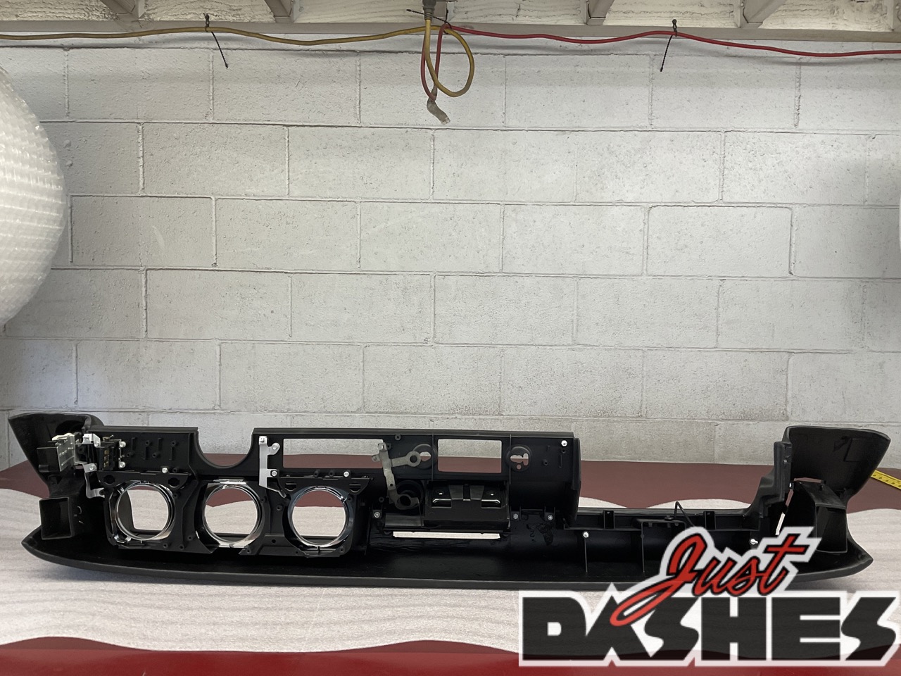 Refurbished car dashboard with black finish