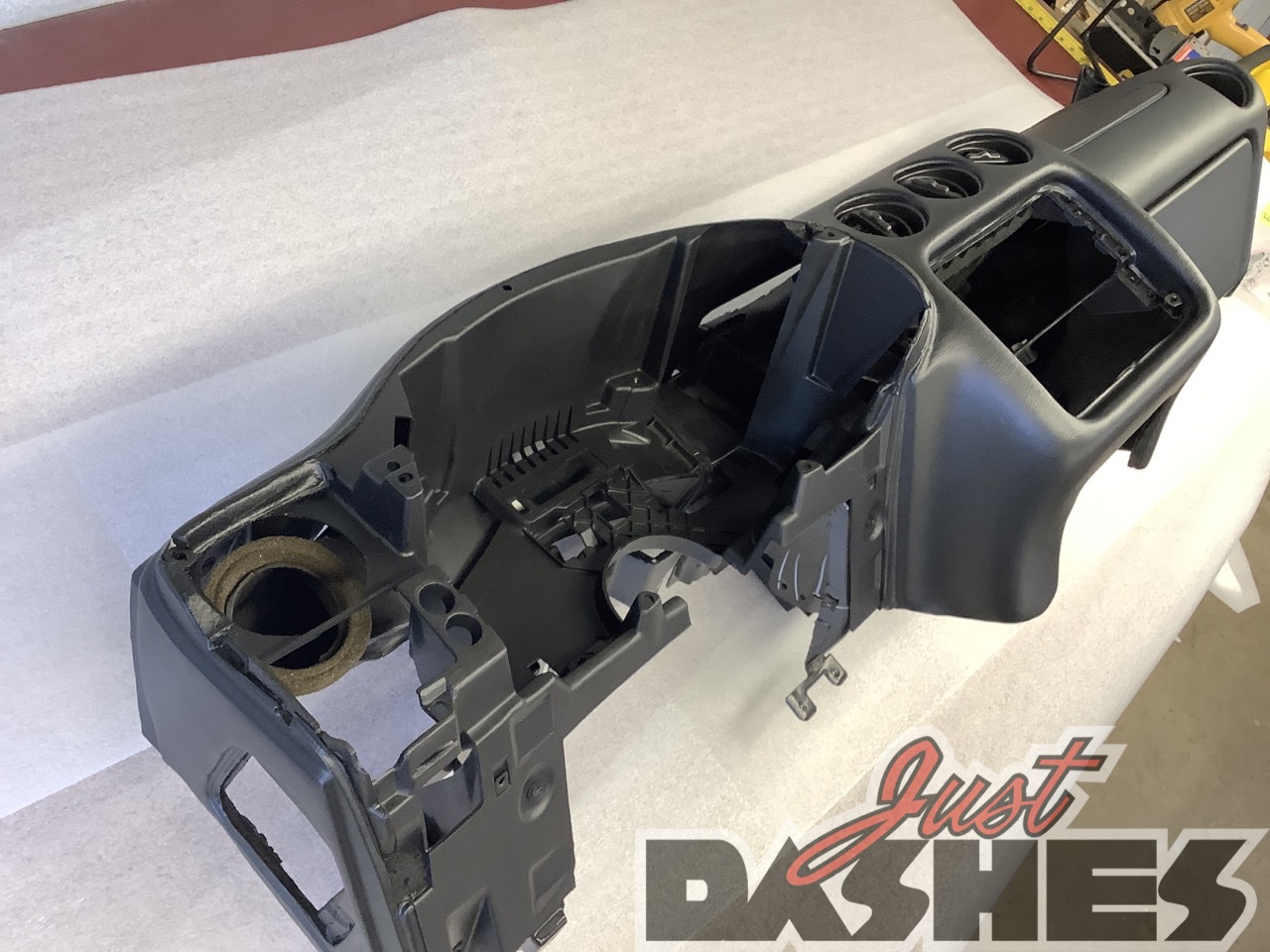A restored 1993 Pontiac Firebird Trans Am dashboard, showcasing its original design and iconic features.